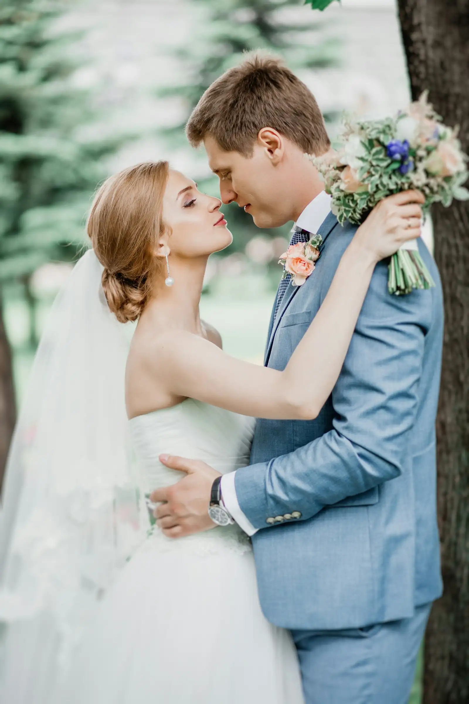 Surprise Proposal & Engagement Sessions Engaged couple sharing an intimate moment in a Dolomites forest