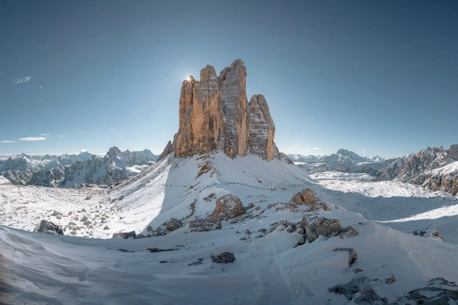 Tre Cime di Lavaredo Wedding & Elopement Photographer: Pricing & Packages Tre Cime di Lavaredo dusted with fresh snow under a clear blue sky